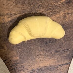 Bark Super Chewer Yellow Croissant Toy